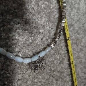 Silver and Light Blue Beaded Necklace with Bow Charm